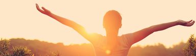 Freeing Your Shoulders Arms and Hands Awareness Through Movement Program product image of a woman with outstretched arms, palms up, watching sunsrise